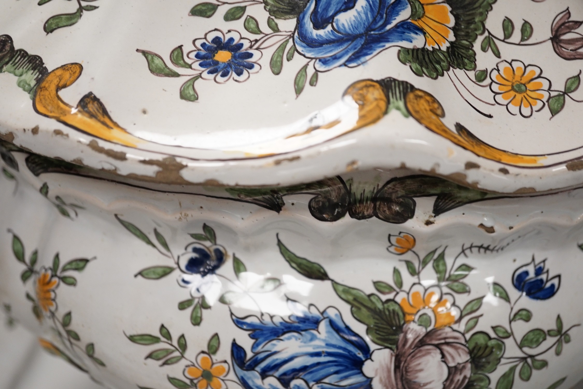 A 19th century French faience large tureen, cover and stand, 49cm wide